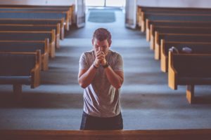 Man kneeling to pray