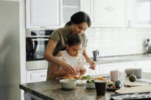 Girl and mother having diner