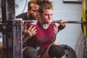 woman carrying barbells